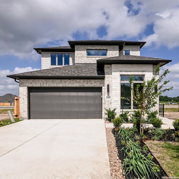Front exterior of a new home in Legacy at Lake Dunlap, New Braunfels, TX, highlighting curb appeal (Image 1). Front exterior of a new home in Legacy at Lake Dunlap, New Braunfels, TX, highlighting curb appeal (Image 1).