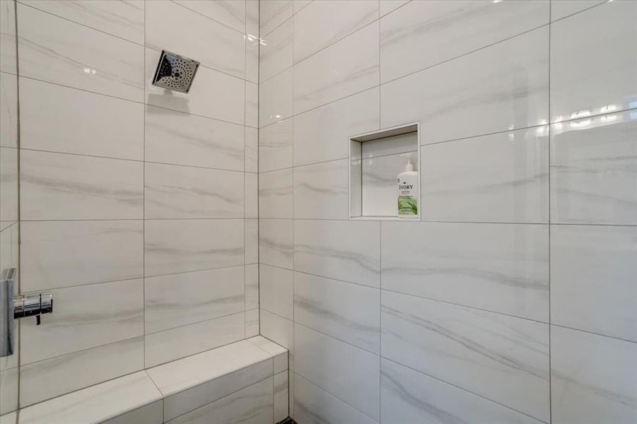 Bathroom featuring a tile shower