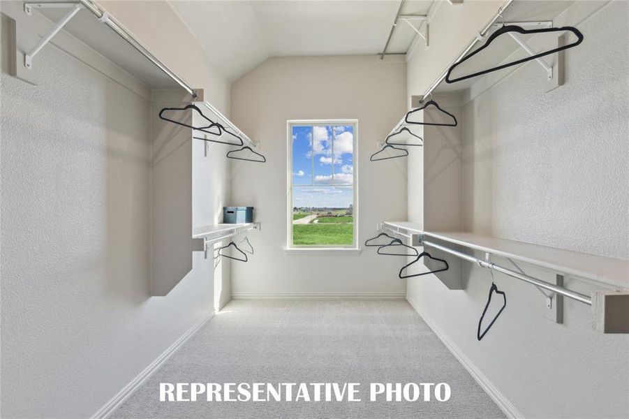 Your new dream owner's closet offers great natural light and seasonal hanging space!  REPRESENTATIVE PHOTO