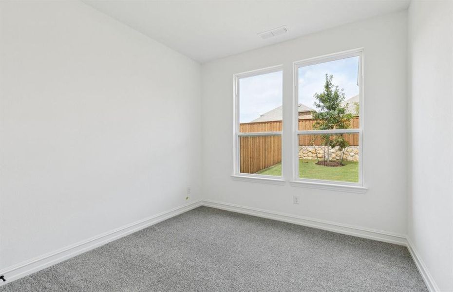 Secondary bedroom designed for comfort and convenience   *Real home pictured