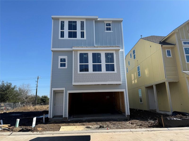 Three story home with 4 beds, 3.5 baths, and 2 car garage