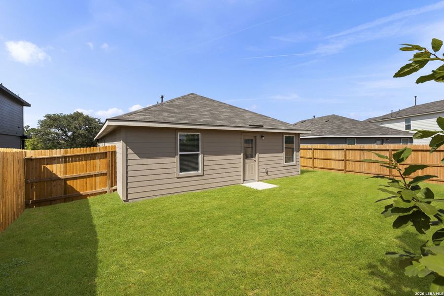 Exterior details and patio area of a home in Redbird Ranch, San Antonio (Image 23).