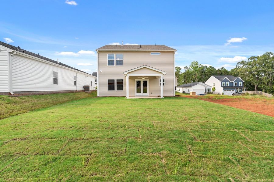 Front exterior of a new home in Mayfair Village, Spartanburg, SC, highlighting curb appeal (Image 2). Front exterior of a new home in Mayfair Village, Spartanburg, SC, highlighting curb appeal (Image 2).