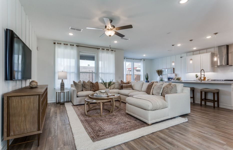 Spacious gathering room with view of kitchen