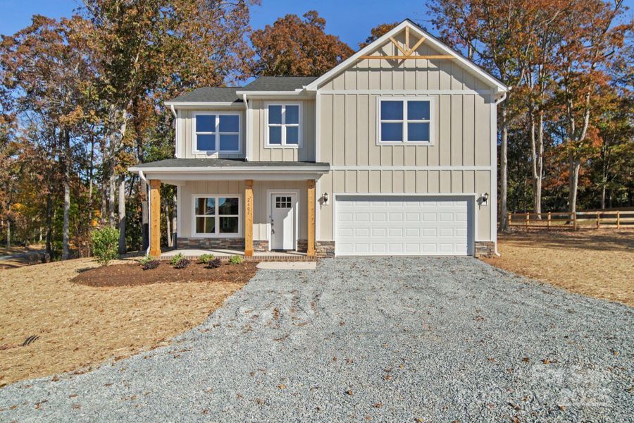 Front exterior of a new home in , Monroe, NC, highlighting curb appeal (Image 1).