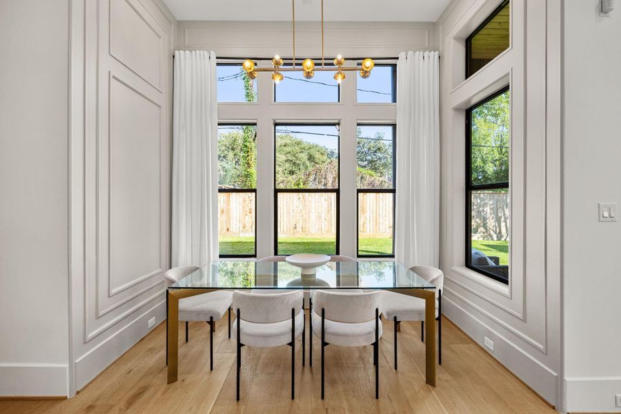 Breakfast area with many windows & transoms allow natural light into the home. Breakfast area with many windows & transoms allow natural light into the home.