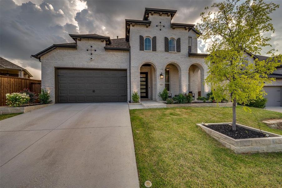 Front exterior of a new home in Sandbrock Ranch: 50ft. lots, Aubrey, TX, highlighting curb appeal (Image 1).