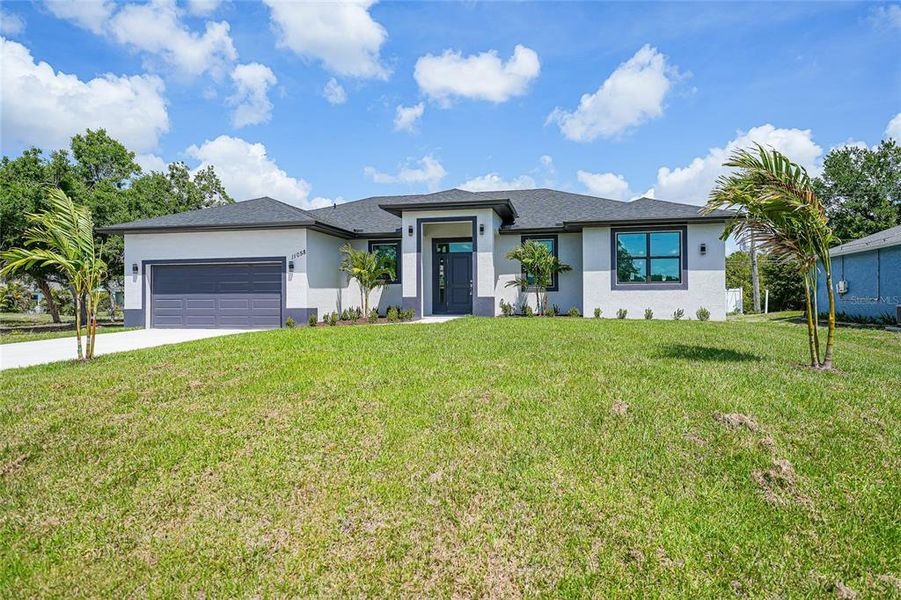 Front exterior of a new home in , Englewood, FL, highlighting curb appeal (Image 30).