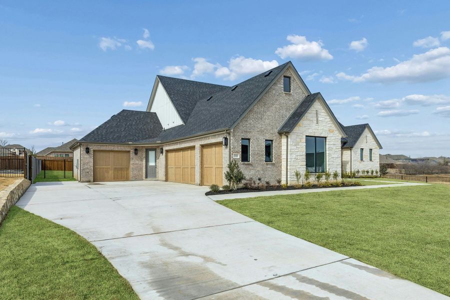 Representative exterior photo of a completed home built from the Custom 3640 by Kindred Homes in The Vines, Haslet, TX (Image 2). Representative exterior photo of a completed home built from the Custom 3640 by Kindred Homes in The Vines, Haslet, TX (Image 2).