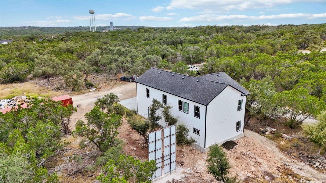 Aerial view of back of home with solar panels