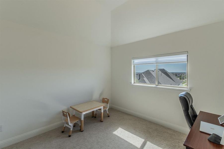 Neutral wall finishes with a window offering architectural views