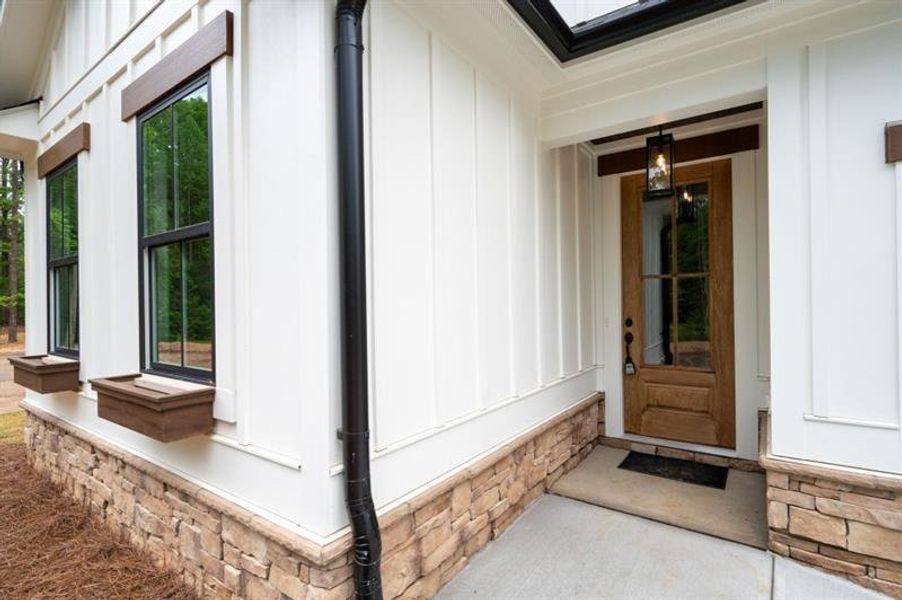 Front exterior of a new home in , Dallas, GA, highlighting curb appeal (Image 21).