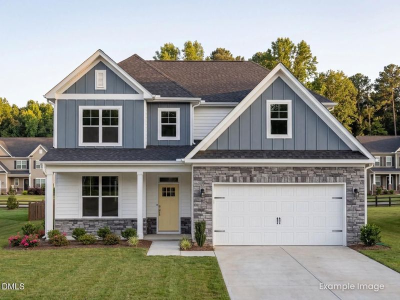 Front exterior of a new home in Woodland Crossing, Zebulon, NC, highlighting curb appeal (Image 2). Front exterior of a new home in Woodland Crossing, Zebulon, NC, highlighting curb appeal (Image 2).
