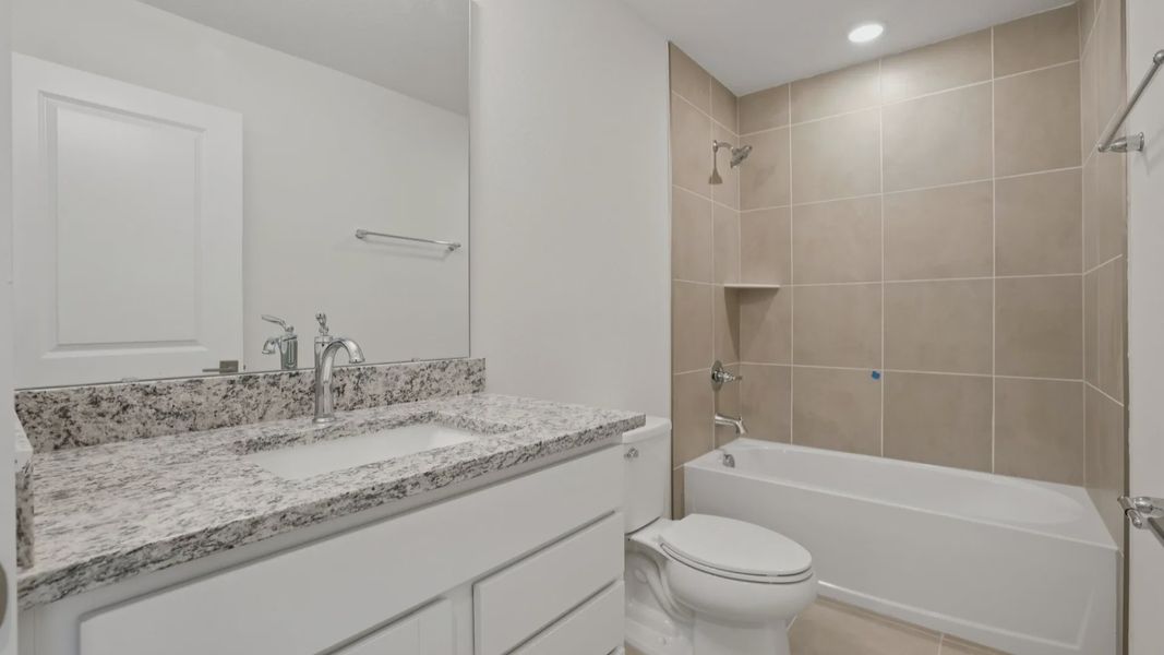Secondary Bath of the Coronado - End at Cyrene at Harmony located in St Cloud FL by DRB Homes