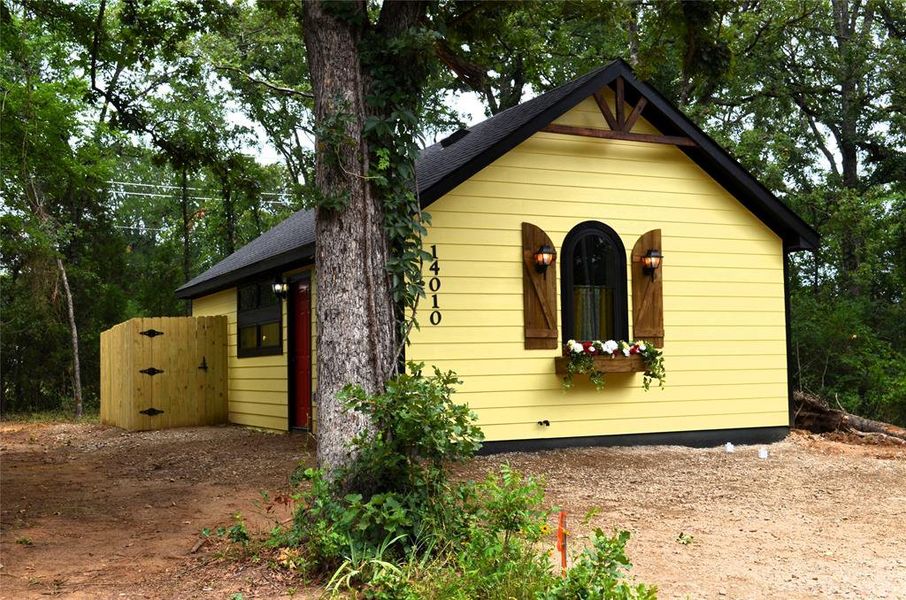 Exterior details and patio area of a home in , Log Cabin (Image 10).