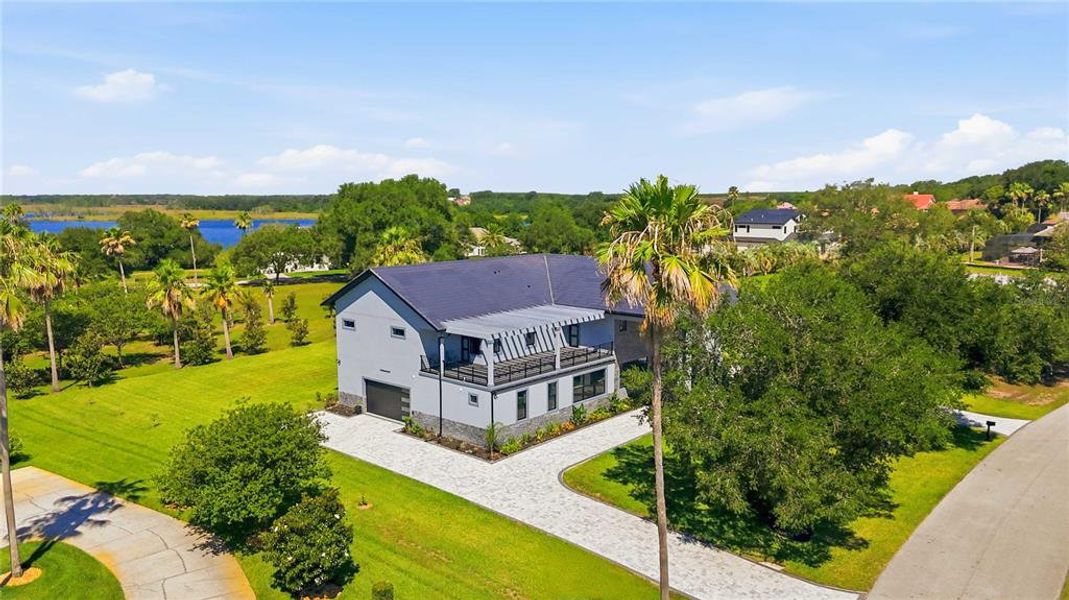 Front exterior of a new home in , Groveland, FL, highlighting curb appeal (Image 22).