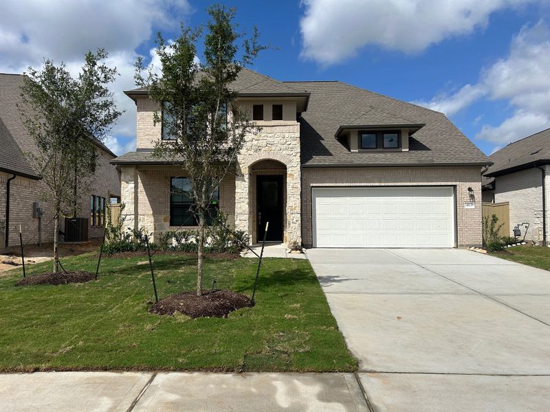 Front exterior of a new home in Westland Ranch, League City, TX, highlighting curb appeal (Image 17).