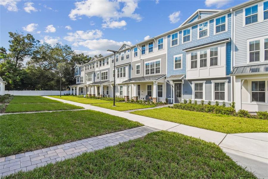 Front exterior of a new home in Vdara, Orlando, FL, highlighting curb appeal (Image 1). Front exterior of a new home in Vdara, Orlando, FL, highlighting curb appeal (Image 1).