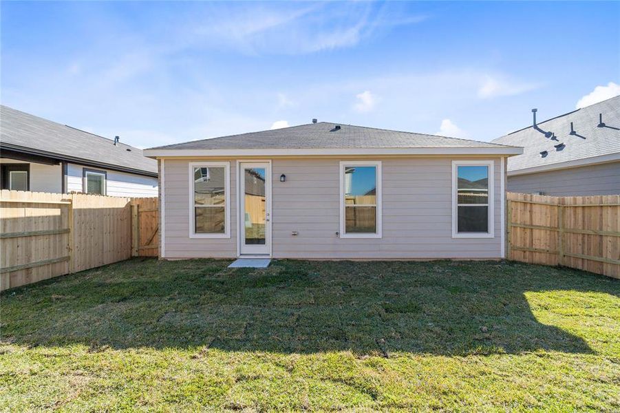 Come and see this spacious backyard! There is plenty of room for the kids to play and adults to relax! The possibilities are endless!