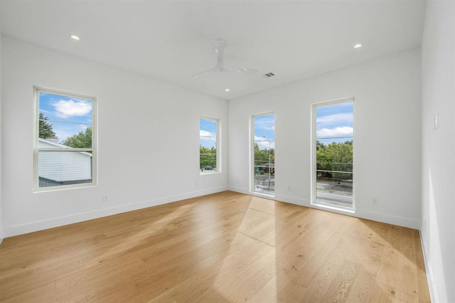 Spare room featuring light wood-style floors, recessed lighting, and ceiling fan