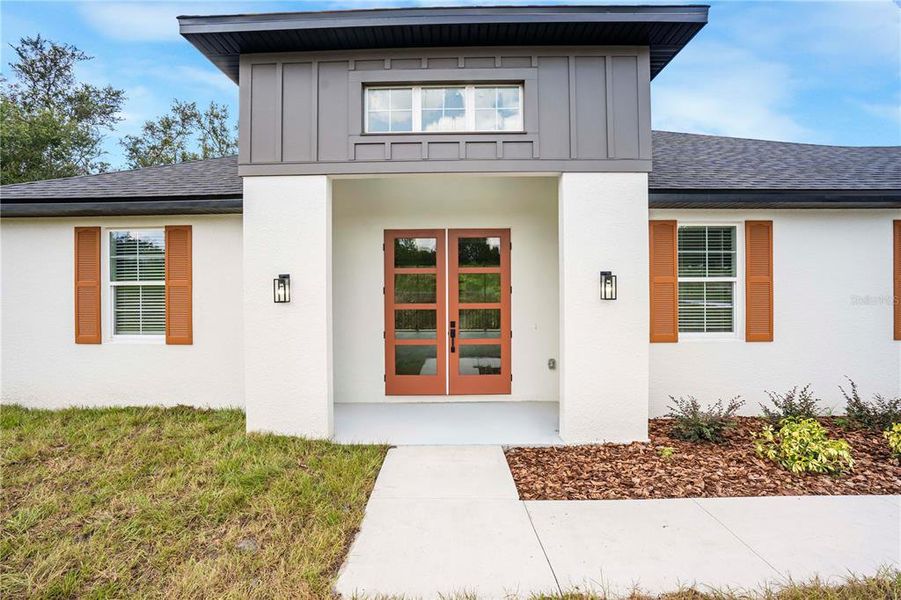 Front exterior of a new home in , Fruitland Park, FL, highlighting curb appeal (Image 2).
