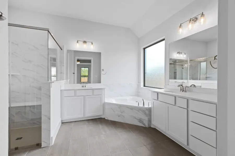 Primary Bath retreat with dual vanities & garden tub & walk-in shower Primary Bath retreat with dual vanities & garden tub & walk-in shower