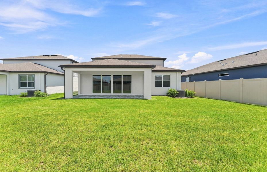 Exterior details and patio area of a home in Vida's Way, Wesley Chapel (Image 4).