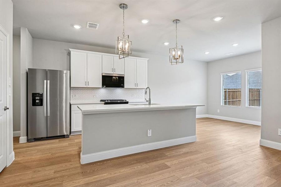 Furnished interior view inside a new home in Parks at Foster Crossing - Signature Series, Anna (Image 7).