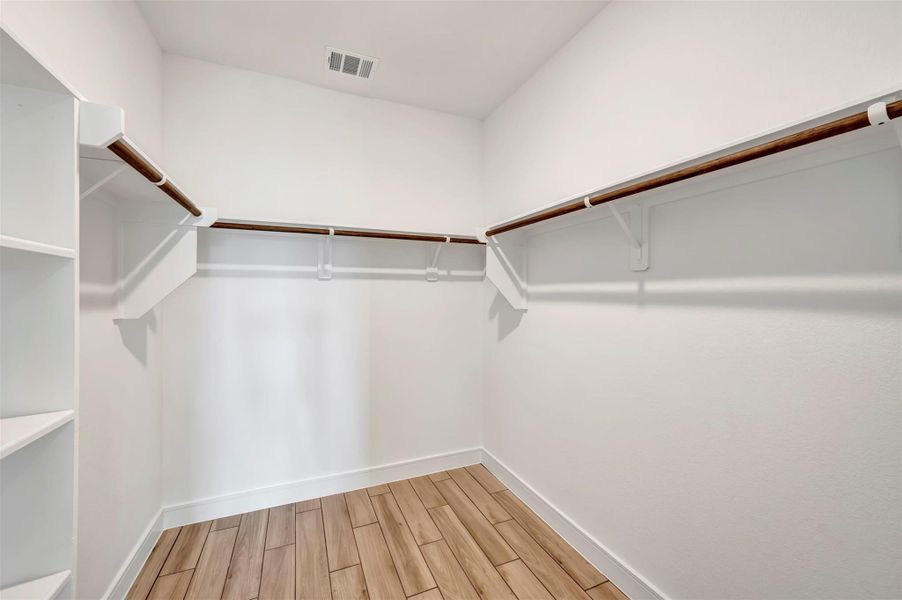 Primary walk-in closet Primary walk-in closet