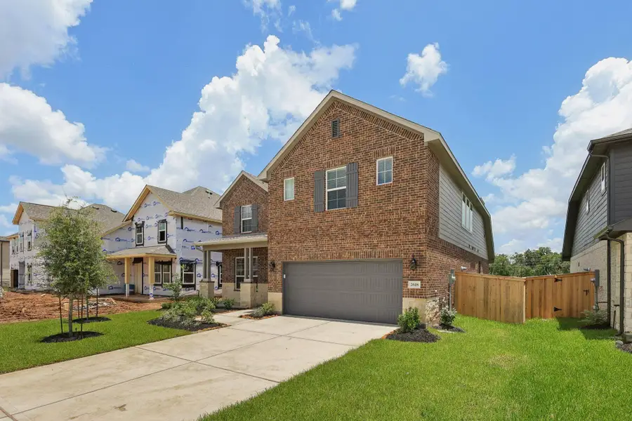 Front exterior of a new home in Kingdom Heights, Rosenberg, TX, highlighting curb appeal (Image 1).