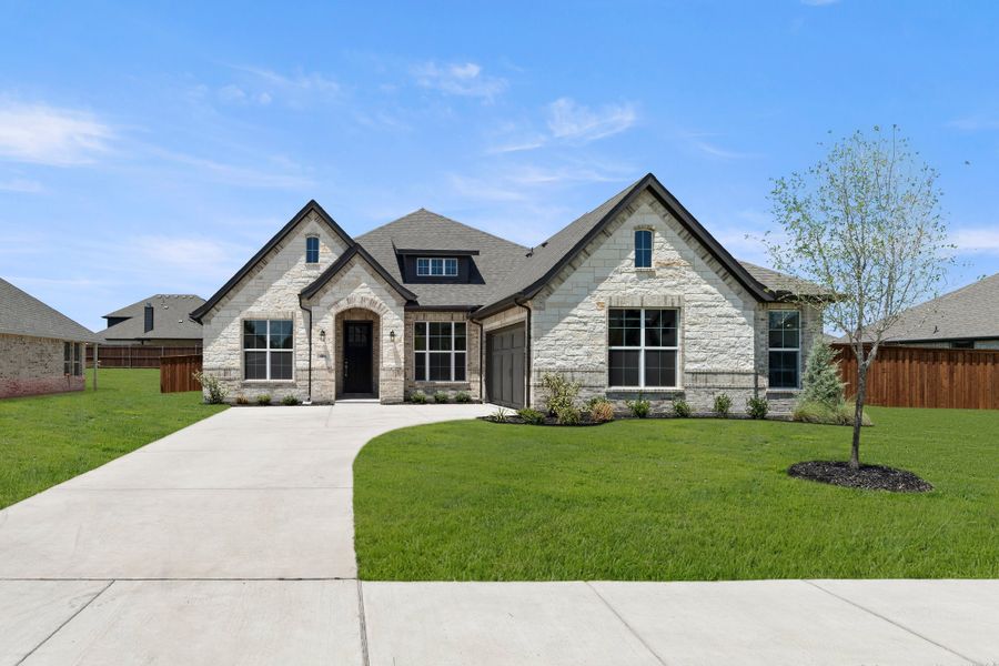 Front exterior of a new home in Lovers Landing, Forney, TX, highlighting curb appeal (Image 1). Front exterior of a new home in Lovers Landing, Forney, TX, highlighting curb appeal (Image 1).
