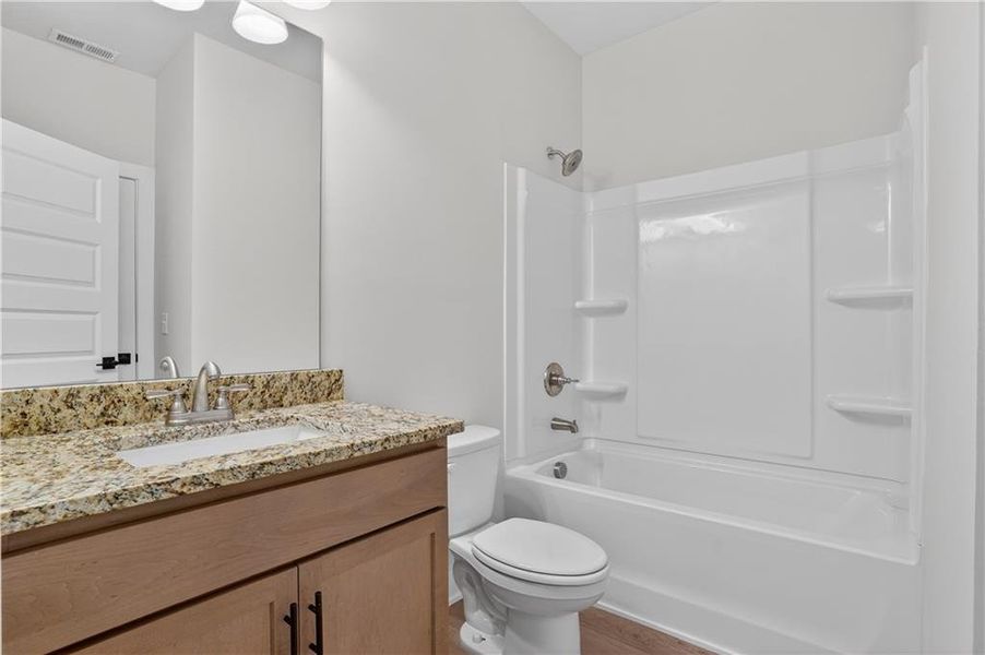 Furnished interior view inside a new home in The Fairways at Mirror Lake, Villa Rica (Image 8).