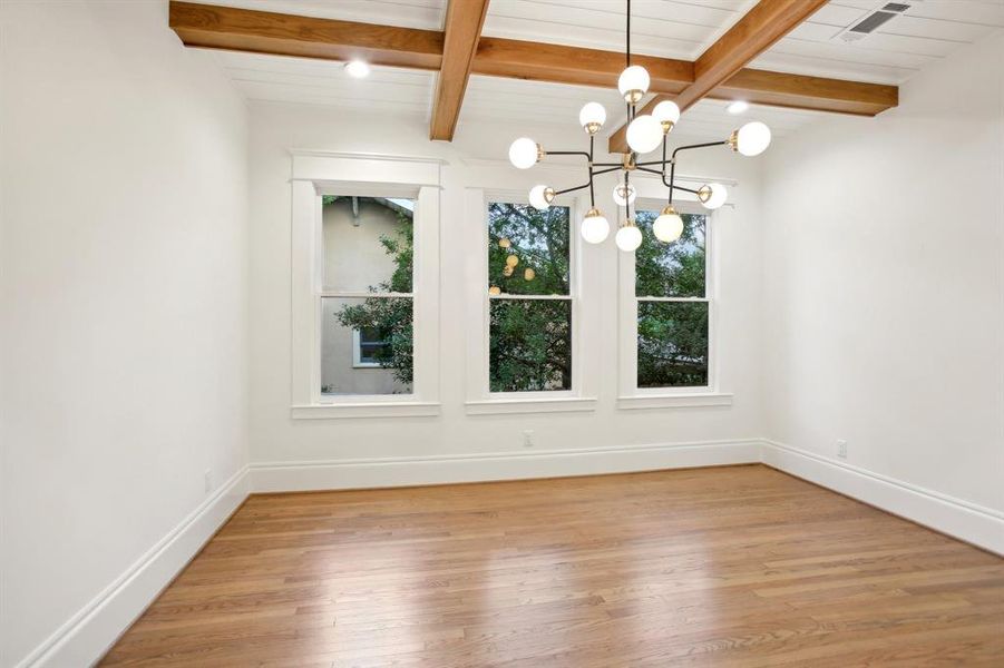 The dining room is a perfect place to hang your art under these cool decorative Oak beams.