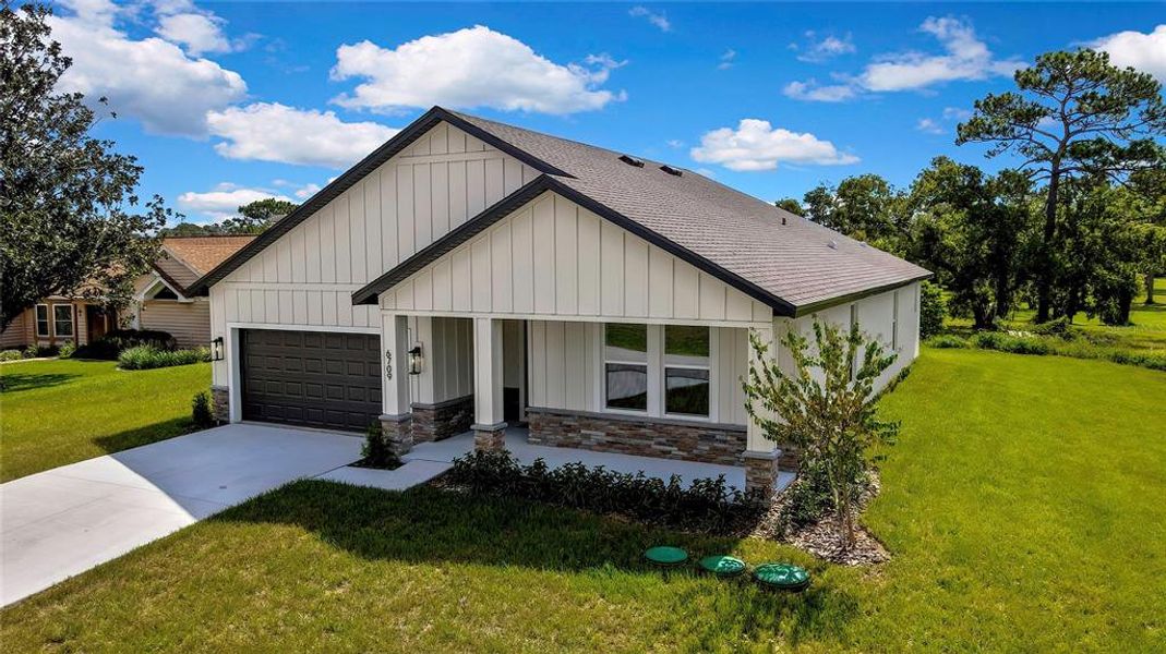 Front exterior of a new home in , Spring Hill, FL, highlighting curb appeal (Image 23).