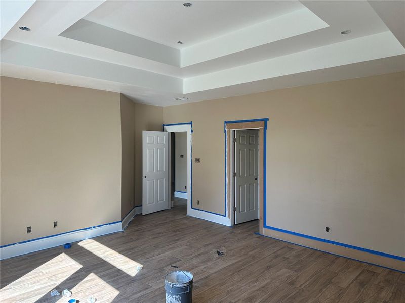 Retreat to a spacious primary suite accented by high ceilings and an open, airy feel. Retreat to a spacious primary suite accented by high ceilings and an open, airy feel.