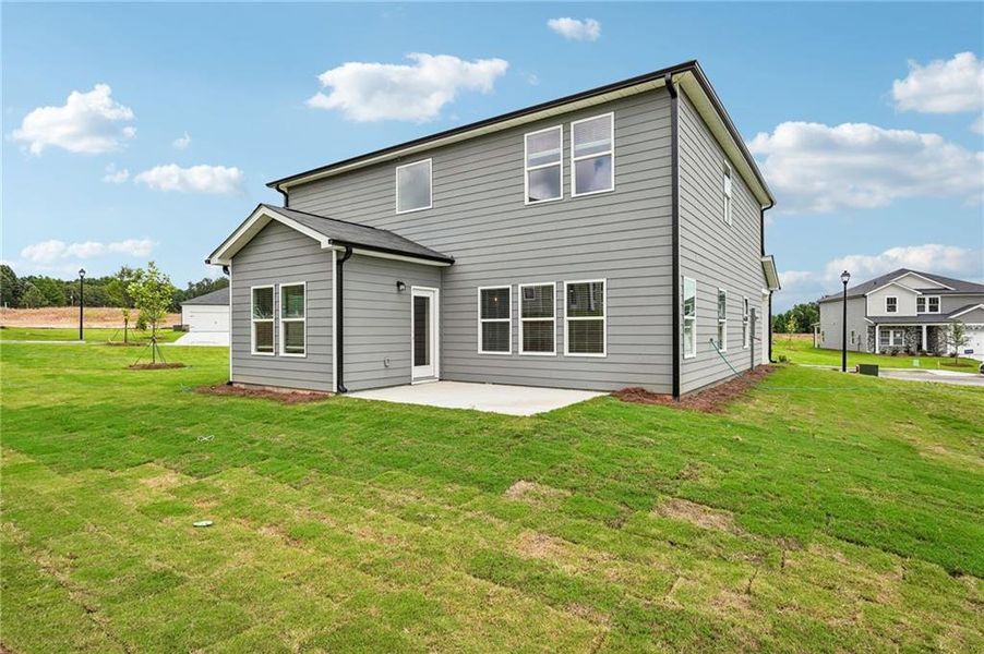Exterior details and patio area of a home in Northwoods at Mirror Lake, Villa Rica (Image 30).