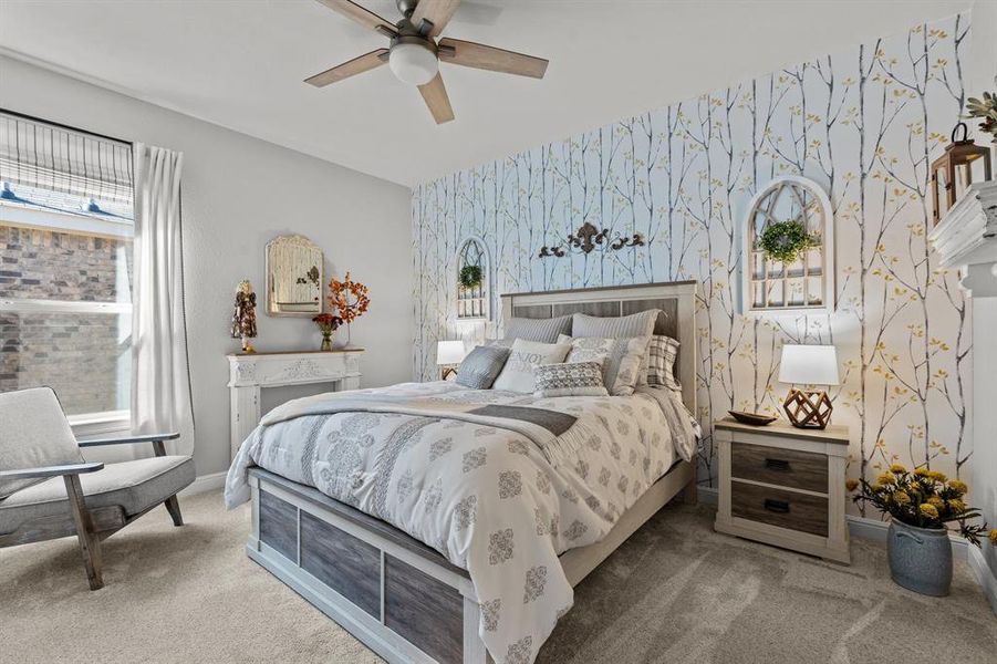 Bedroom with ceiling fan and carpet floors