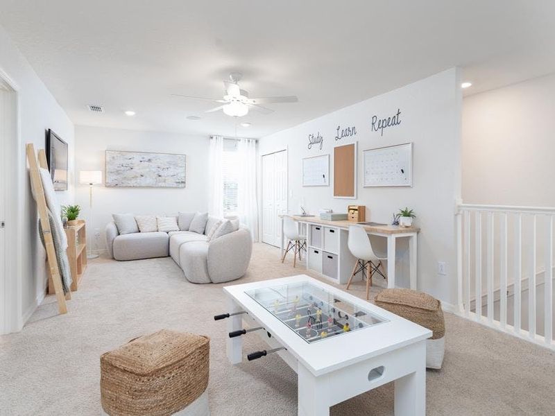 Upstairs, a flexible-use loft is located at the stair landing - Wesley II by Highland Homes Upstairs, a flexible-use loft is located at the stair landing - Wesley II by Highland Homes