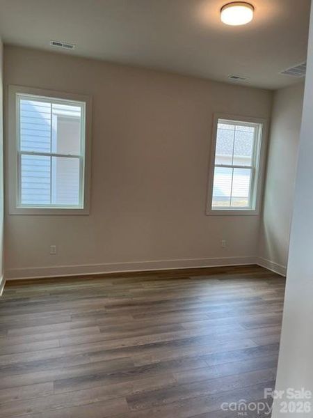 Owner's Bedroom w/Plank Flooring - Main Level Owner's Bedroom w/Plank Flooring - Main Level