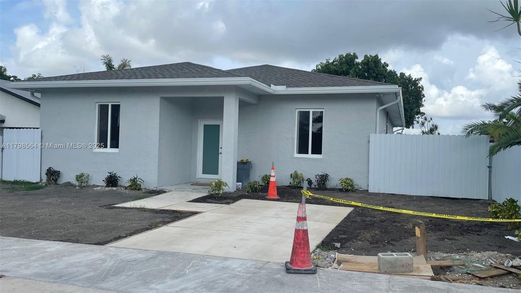 Front exterior of a new home in , Homestead, FL, highlighting curb appeal (Image 12).