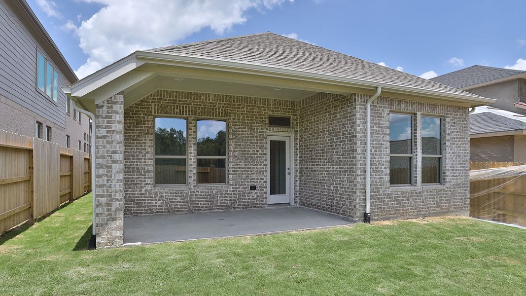 Exterior details and patio area of a home in Wildtree, Magnolia (Image 2).