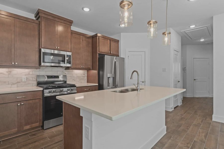Representative furnished interior of a home built from the Carriagehouse by Chesmar Homes in Meridiana Townhomes, Iowa Colony (Image 17).