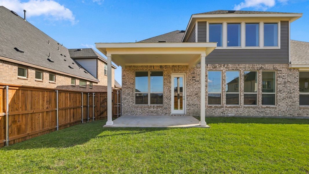 Exterior details and patio area of a home in Green Meadows Classic, Celina (Image 28).
