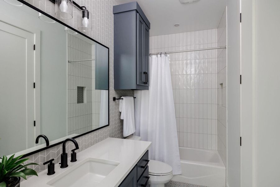 Additional bathrooms maintain a cohesive design with elevated materials and modern fixtures throughout. Additional bathrooms maintain a cohesive design with elevated materials and modern fixtures throughout.