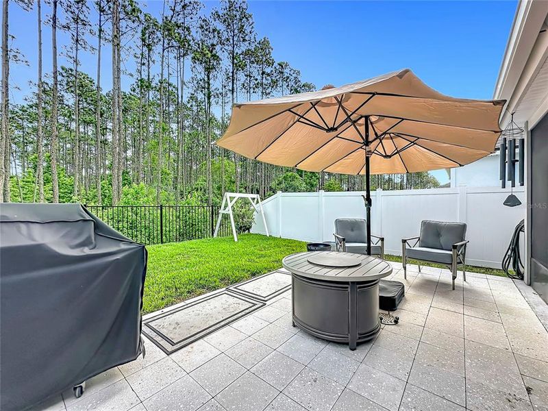 Exterior details and patio area of a home in Sawmill Branch Express, Palm Coast (Image 24).