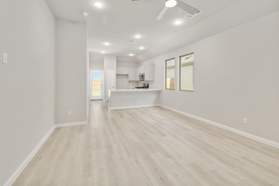 Living an Dining Area in the Ash home plan by Trophy Signature Homes – REPRESENTATIVE PHOTO