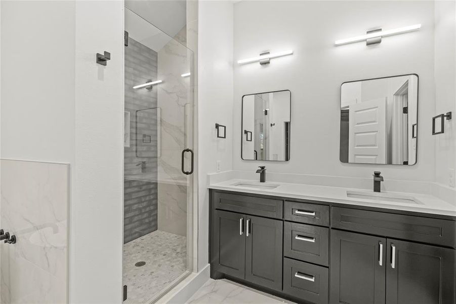 Bathroom with a shower with door and vanity