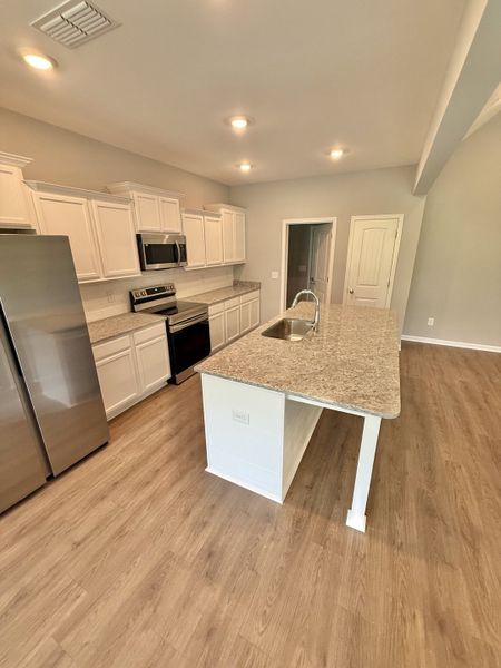 Furnished interior view inside a new home in Stone Fort Meadows, Manchester (Image 3).