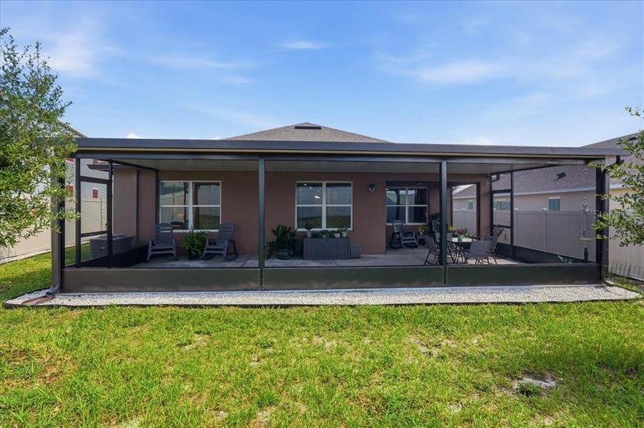 Exterior details and patio area of a home in Eden Hills, Lake Alfred (Image 25).