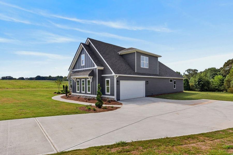 Front exterior of a new home in Veal Meadows, Roopville, GA, highlighting curb appeal (Image 2). Front exterior of a new home in Veal Meadows, Roopville, GA, highlighting curb appeal (Image 2).
